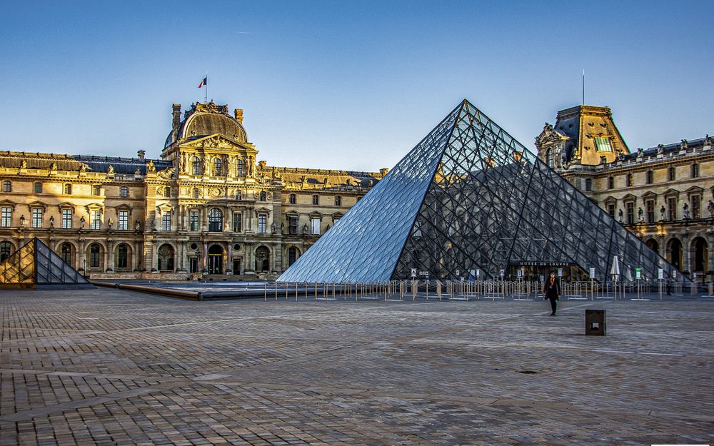The Louvre pyramid in Paris at golden hour