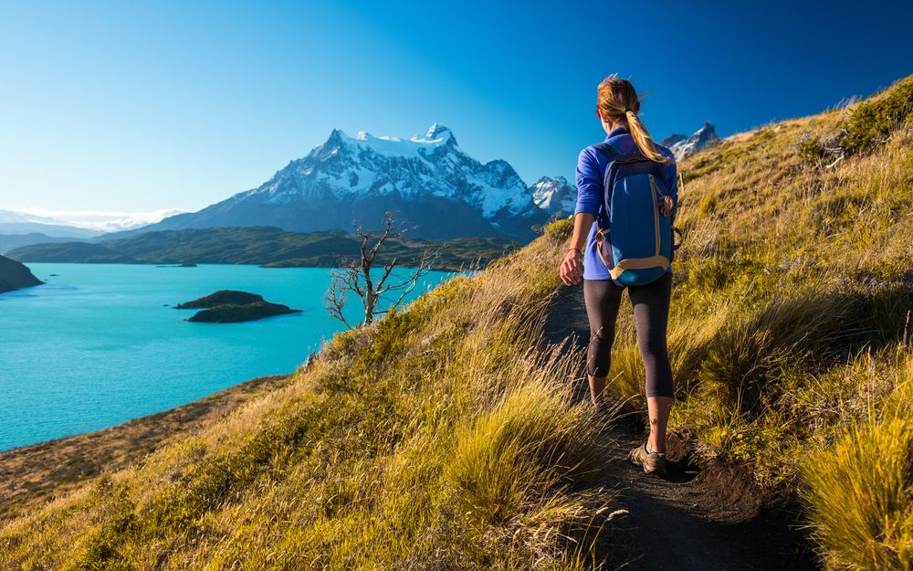 A hiker above the lakes of Torres del Paine