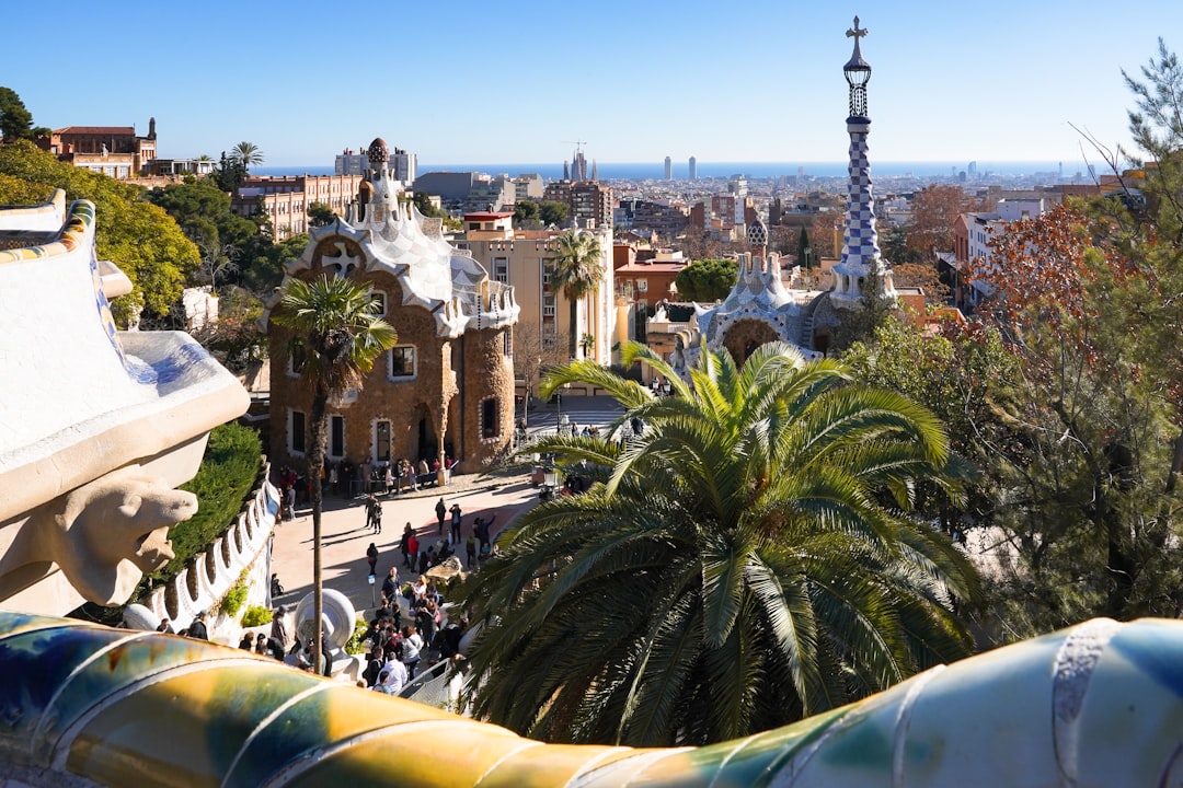 Colorful mosaic bench and terrace at Park Guell overlooking Barcelona