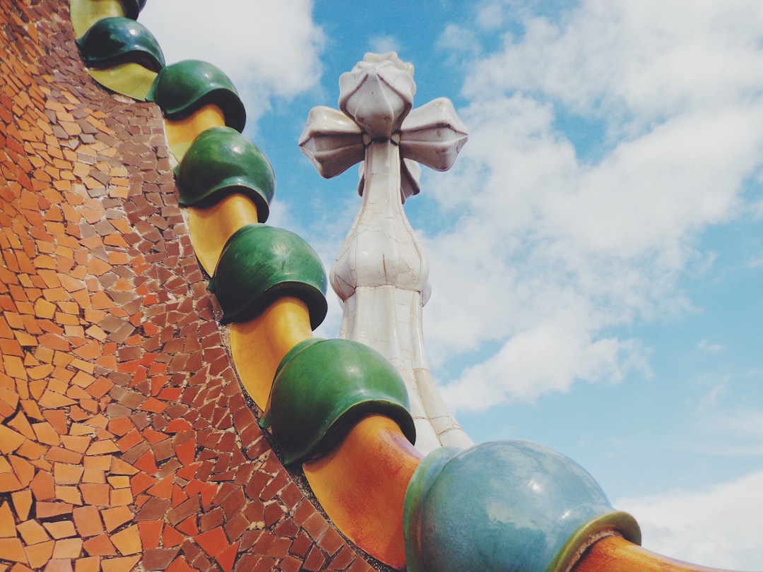 Casa Batllo facade with colorful mosaic tiles and curved balconies