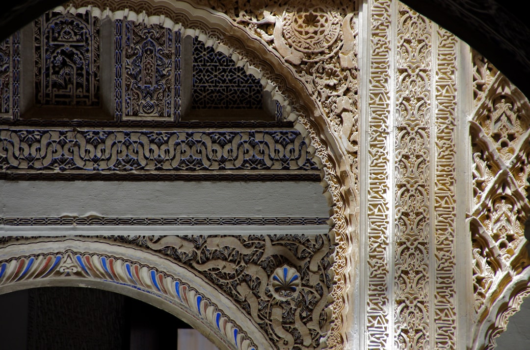 Moorish arches and tilework inside the Royal Alcazar of Seville